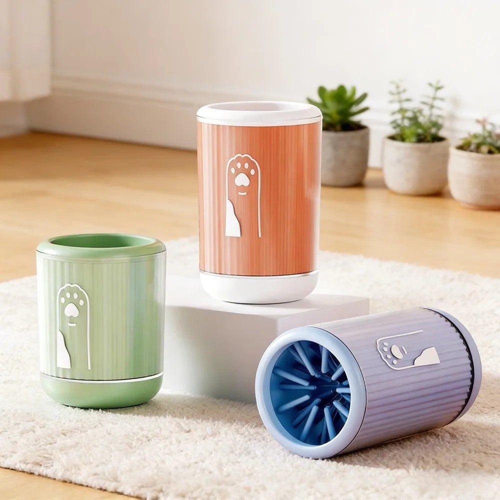 Soralab PawClean Pro silicone dog paw cleaner cup in green, orange, and purple, with soft bristles inside.